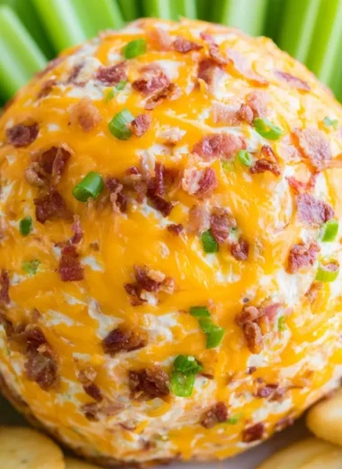 Delicious Bacon Ranch Cheeseball served on a platter with crackers