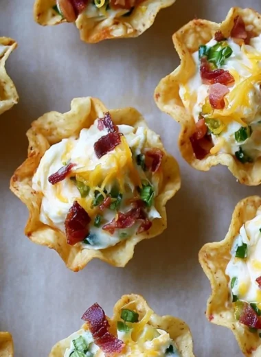 Baked Jalapeño Popper Bites on a platter garnished with green herbs