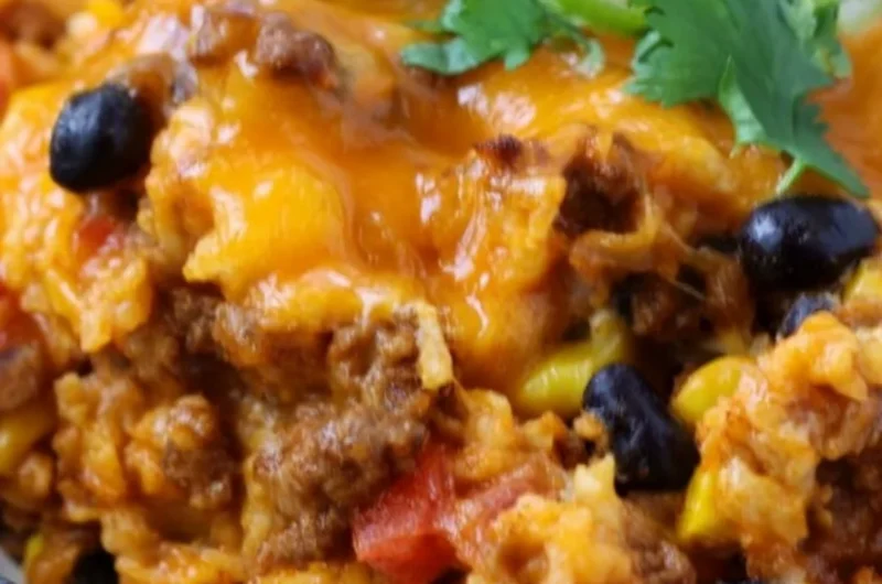 Delicious beef enchilada casserole with rice served in a colorful dish