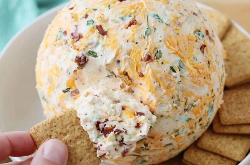 Delicious easy cheese ball appetizer served on a platter with crackers and veggies