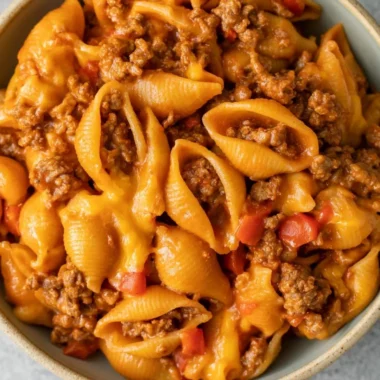 High protein taco pasta dish with colorful toppings and ingredients