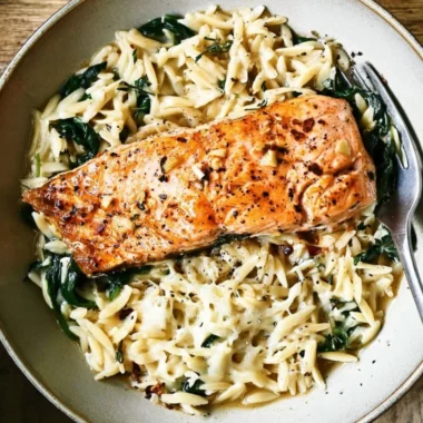 One Skillet Salmon dish served with Lemon Orzo on a plate
