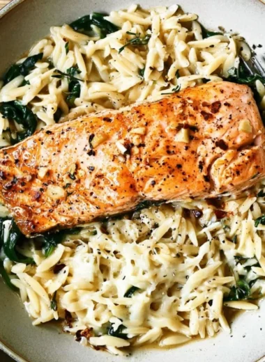One Skillet Salmon dish served with Lemon Orzo on a plate