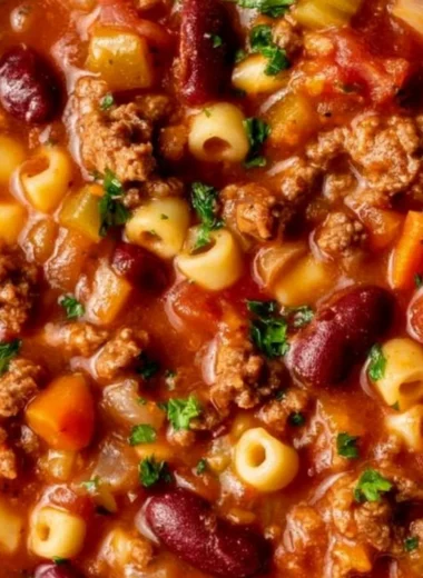 Bowl of Pasta and Beans with fresh herbs and vegetables