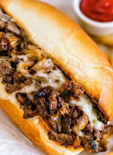 Delicious Philly Cheesesteak sandwich with melted cheese and tender beef