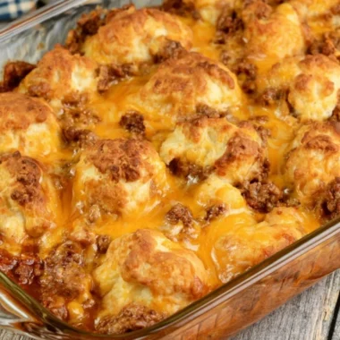 Casserole dish filled with Sloppy Joe Biscuit Casserole, topped golden brown.